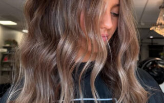 A photo of a woman with old money brunette hair color