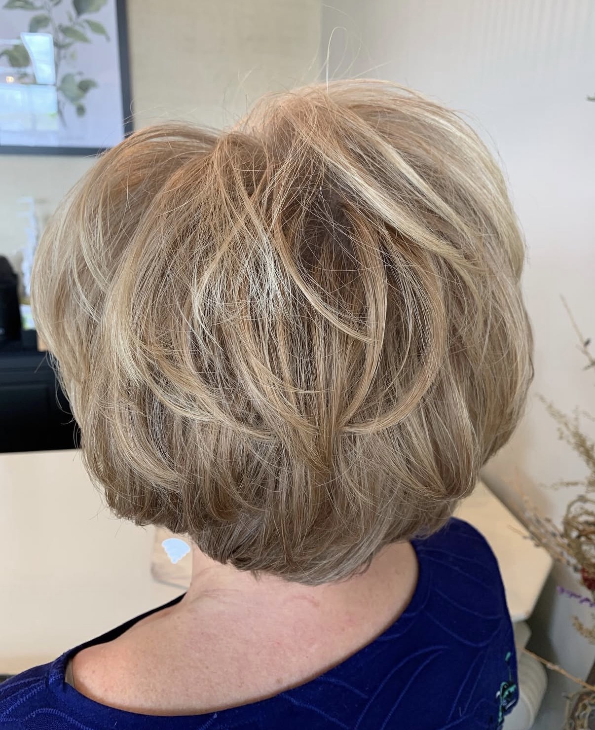 A photo of a woman over 40 showing off her haircut & hairstyle