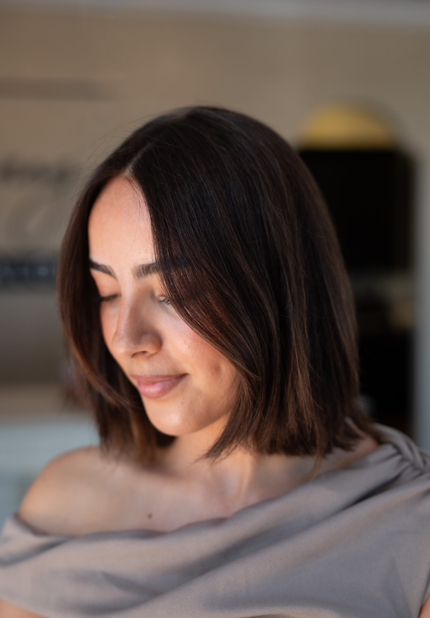 A photo of a female client showing off her new collarbone lob from Jenny's Salon in Mechanicsburg, PA